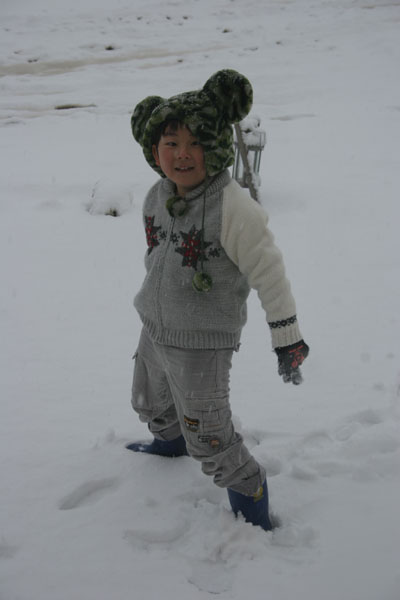 japanese boy playing in the snow
